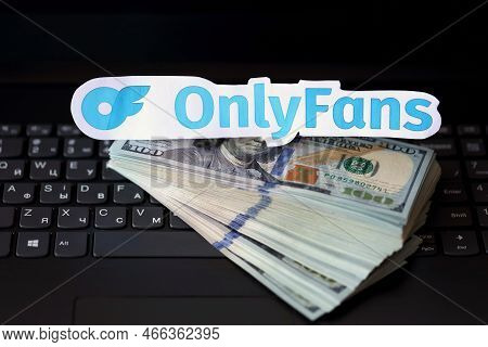 Ternopil, Ukraine - September 6, 2022 Onlyfans Paper Logotype On Bunch Of Us Dollar Bills Lies On Bl