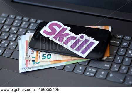 Ternopil, Ukraine - September 6, 2022 Skrill Paper Logotype Lies On Black Laptop Keyboard With Euro 