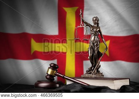 Guernsey Flag With Statue Of Lady Justice, Constitution And Judge Hammer On Black Drapery. Concept O