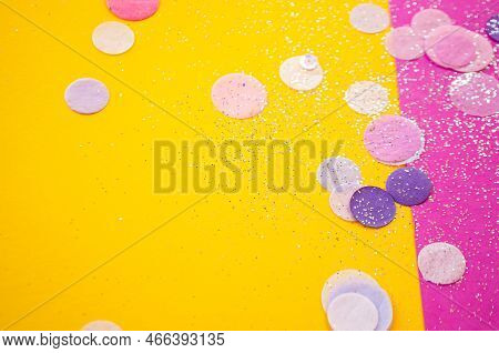Colorful Confetti, Sparkles On Bright Pink And Yellow Background. Blurred Festive Background.