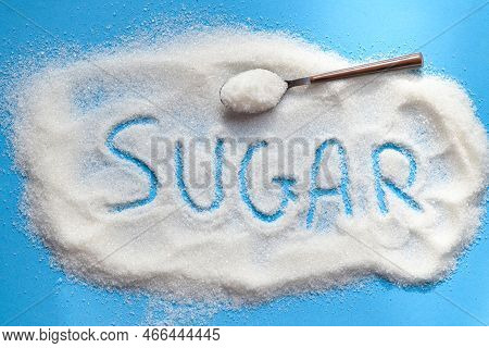 Sugar On Spoon And Blue Background, White Sugar For Food And Sweets Dessert Candy Heap Of Sweet Suga