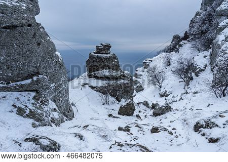Rocks On Mount Alenga Near Southern Demerdzhi In Snow And Ice In Early Spring. Crimea