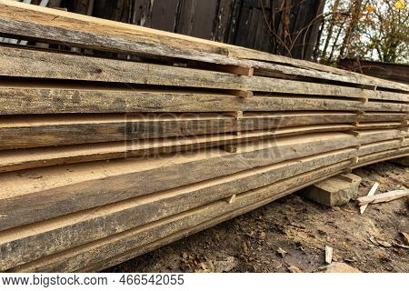 Piled Lumber Near A Lumber Mill. Lumber And Wood Slice. Stacked Lumber. Folded Wood.closeup Wooden B