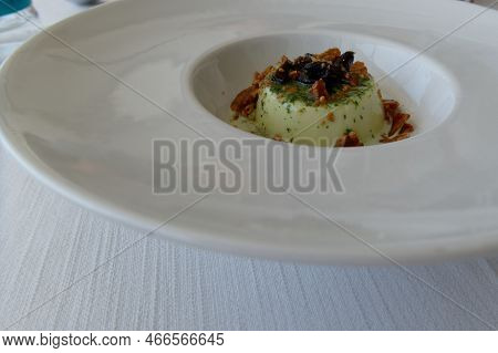 Delicious Italian Dessert Called Panna Cotta Aromatized With Pesto Sauce Garnished With Caramel And 