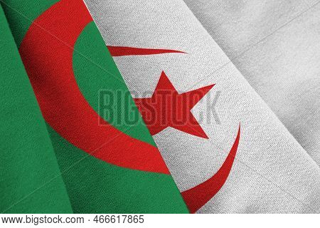 Algeria Flag With Big Folds Waving Close Up Under The Studio Light Indoors. The Official Symbols And