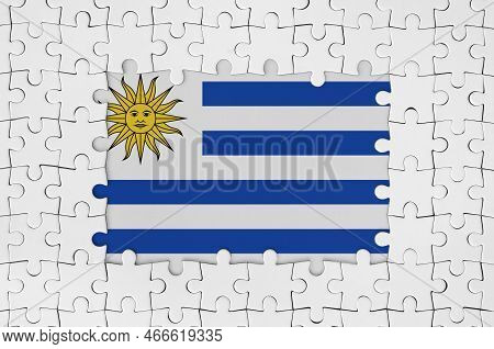 Uruguay Flag In Frame Of White Puzzle Pieces With Missing Central Parts