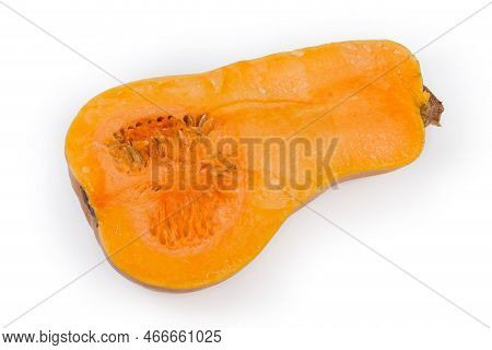 Half Of The Ripe Butternut Squash Cut Lengthwise Covered With Juice Drops, Top View On A White Backg