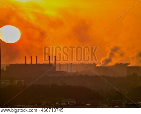 The Rising Sun Over The Steelworks In Ostrowiec Swietokrzyski . Heaven 