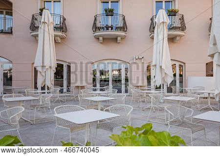 Cityscape. Street City Cafe With Many Empty Tables In Touristic City In Portopiccolo, Sistiana, Ital