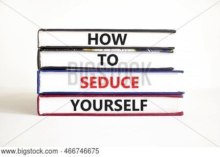 How To Seduce Yourself Symbol. Concept Word How To Seduce Yourself On Books. Beautiful White Table W