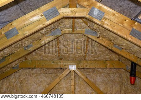 Insulation Of Walls And Ceiling In The Attic Made Of Mineral Wool Between Trusses, Tied With Polypro
