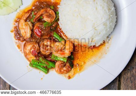 Fried Shrimp With Long Beans On The White Dish.
