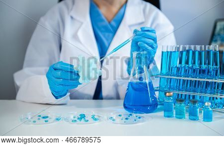 Female Biotechnologist Testing New Chemical Substances In A Laboratory. Test Tubes In Clinic, Pharma