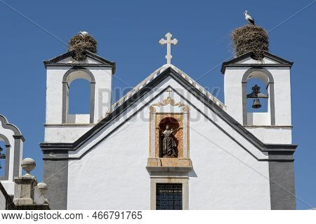 Faro, Portugal, September 2022: Stork Nests On The Tower Of A Convento De Santo António Dos Capuchos