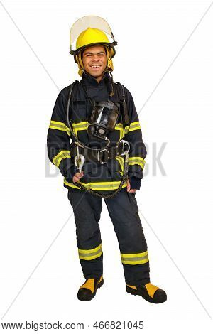 Full Body Young Smiling African-american Fireman In A Fireproof Uniform Stands And Looks At The Came