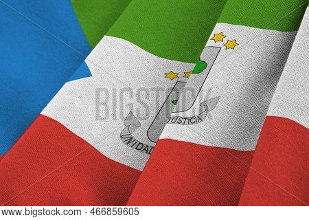 Equatorial Guinea Flag With Big Folds Waving Close Up Under The Studio Light Indoors. The Official S