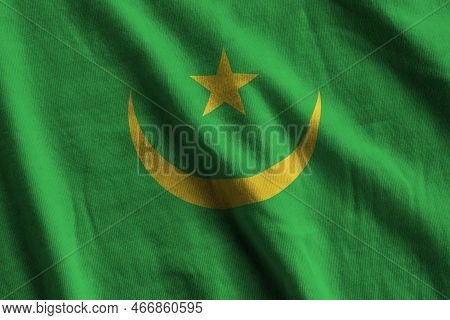 Mauritania Flag With Big Folds Waving Close Up Under The Studio Light Indoors. The Official Symbols 