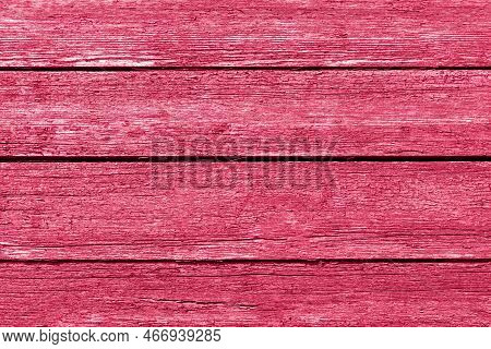 Vintage Wooden Background With Peeling Red Paint. Trendy Viva Magenta Color Of The Year 2023