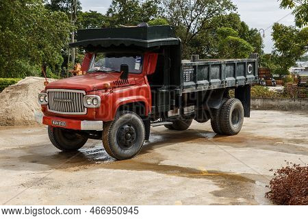 Air Itam, Penang, Malaysia - November 27, 2017: Old Nissan Diesel Truck. Car With A Red Cab Is Stand