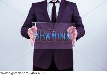 Conceptual Caption Shaming. Business Overview Subjecting Someone To Disgrace, Humiliation, Or Disrep