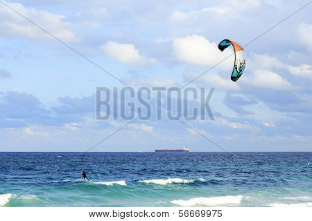 Kiteboarder And Tanker Cargo Boat