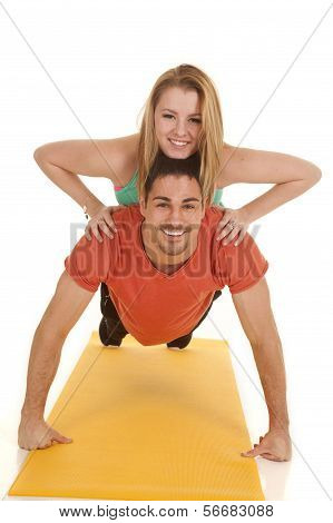 Man Pushup Woman On Back Smiles