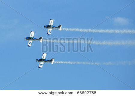 BERLIN, GERMANY - MAY 21, 2014: Aerobatic team 3x Fly Sinthesis Texan Top Class (Wefly team, Italy) demonstration during the International Aerospace Exhibition ILA Berlin Air Show-2014.