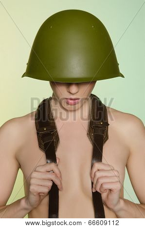 Woman In Army Helmet With A Belt On Neck