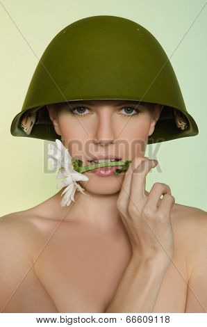 Woman In A Military Helmet With Chamomile Mouth
