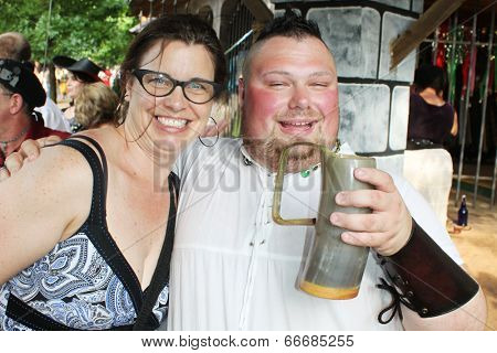 MUSKOGEE, OK - MAY 24: A man dressed in historic clothing enjoys a drink during the Oklahoma 19th annual Renaissance Festival on May 24, 2014 at the Castle of Muskogee in Muskogee, OK. 