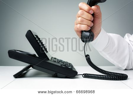 businessman on business landline telephone in an office concept for communication, contact us and customer service support