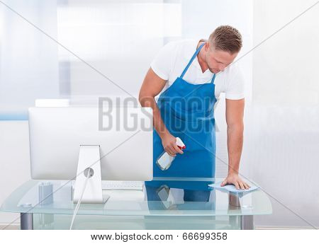 Janitor Or Cleaner Cleaning An Office