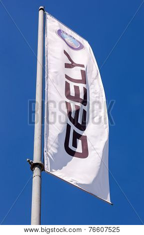 Samara, Russia - May 25, 2014: The Flag Of Geely Over Blue Sky. Geely Is A Chinese Automotive Manufa