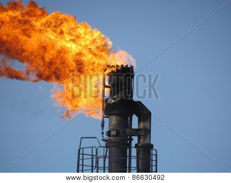 Torch system on an oil field