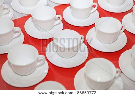 White Tea Cup On A Red Tablecloth