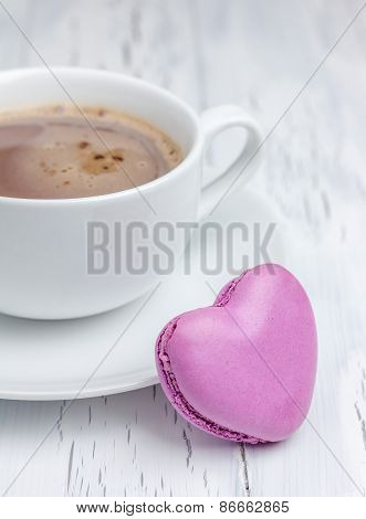 A Cup Of Hot Chocolate With A  Heart-shaped Macaron (vertical)