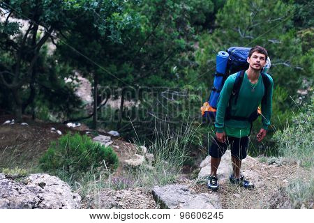 The guy at the foot of the mountain looking up