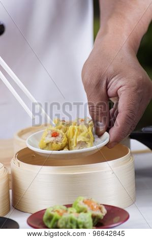 Chef Using Chopsticks Hold Chinese Dumpling