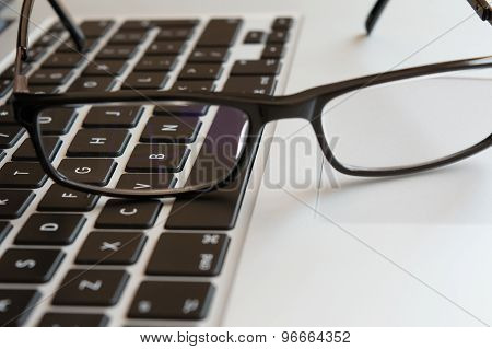 Glasses on a Keyboard