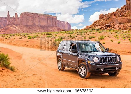 Monument Valley, Utah, Usa - May 25, 2015 - Offroading Through The Monument Valley In A Jeep Patriot