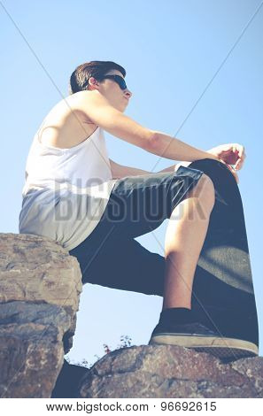 Young Boy With His Skateboard