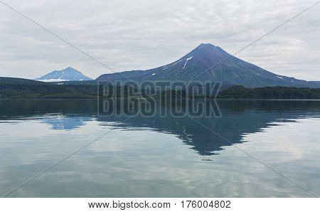 Ilyinsky stratovolcano located in the southern part of Kamchatka Peninsula near Kurile Lake.