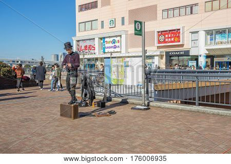 Tokyo, Japan - 17 February 2017: Some people performing in front of Aqua city building in Odaiba Tokyo
