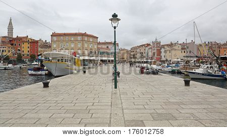 ROVINJ CROATIA - OCTOBER 15: Town and Marina in Rovinj on OCTOBER 15 2014. Picturesque Houses at Seafront From Dock in Rovinj Croatia.