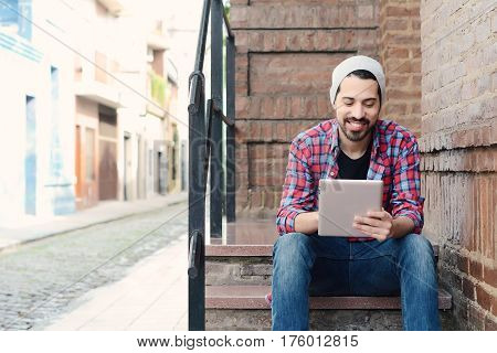 Man Using A Tablet.