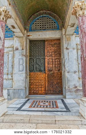 One of the copper doors at an entrance to the shrine Dome of the Rock, an Islamic shrine located on the Temple Mount in the old city Jerusalem, Israel.