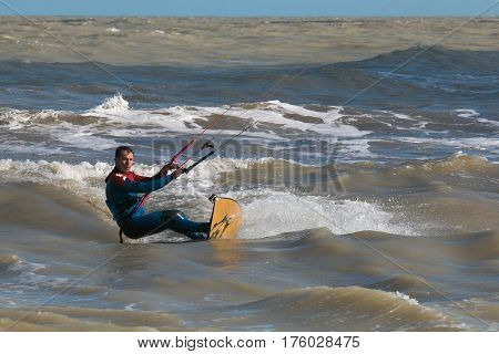 SAN BENEDETTO DEL TRONTO, MARCH 10, 2016: kite surfer rides the waves