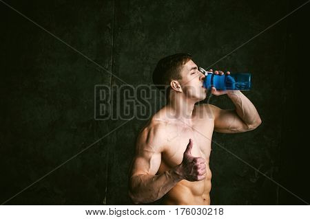Young Sexy Men Bodybuilder Athlete,studio Portrait Loft On Background Of Stylized Wall,guy Model Wit