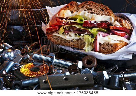 Sandwich with pork lettuce and mayonnaise in a workshop scenery