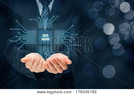 Data mining (data-minig) concept. Abstract symbol of a chip with text data mining connected with data represented by points.